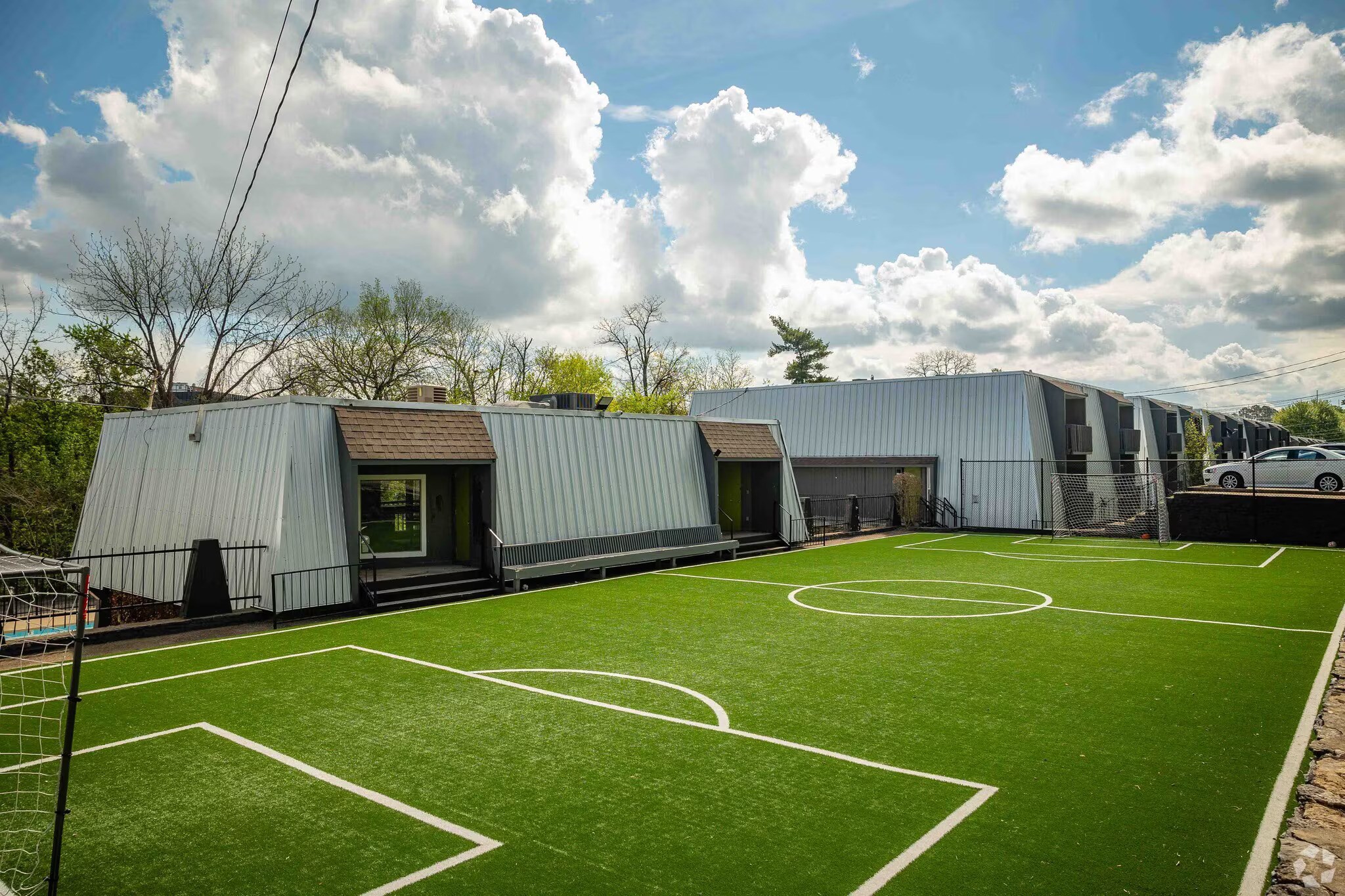 A soccer field with a goal post on the left side.